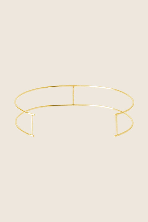 Odkryj unikalny naszyjnik/choker od UMIAR biżuteria, który łączy dwie eleganckie obręcze ORA z pionowymi poprzeczkami, nadając mu wyjątkowy charakter. Ręcznie wykonany, każdy egzemplarz jest unikatowy, a jego nowoczesny design idealnie podkreśli Twoją stylizację. Dostępny w dwóch wariantach: srebrze 925 i srebrze 925 pozłacanym 24-karatowym złotem. Spraw sobie luksus biżuterii, który będzie Twoim nieodzownym dodatkiem. Kup teraz!